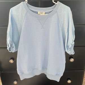 Blue top with puffed sleeves